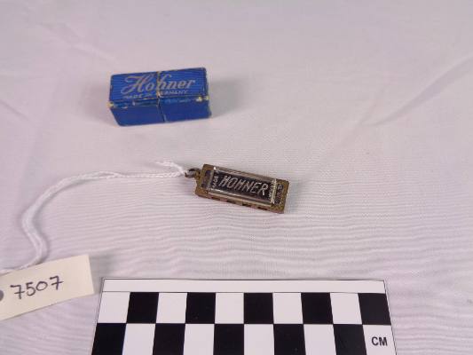 Miniature diatonic harmonica, A