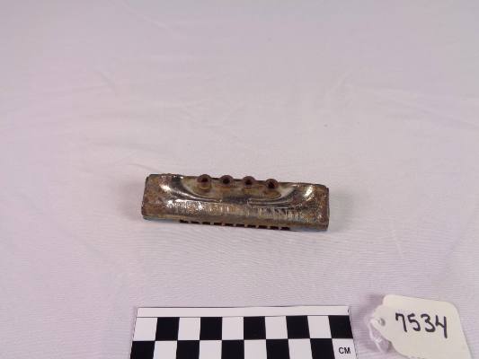 Grommet harmonica